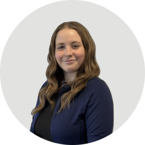 Portrait of Caitlyn, a female Physiotherapist Assistant, smiling on the clinic team page.
